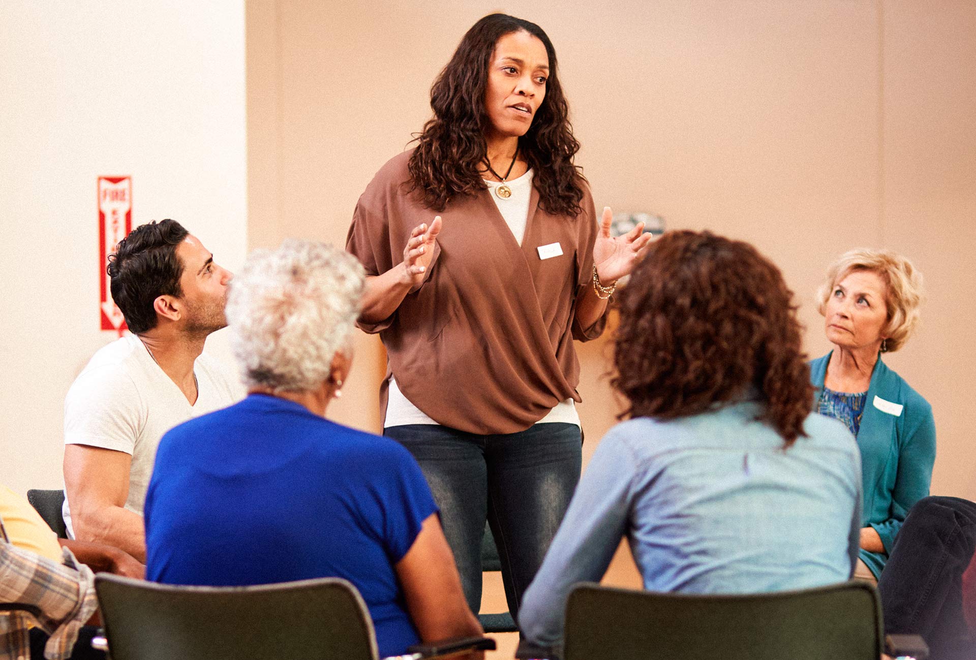 Participants in a Group Therapy session at Valor Lakes’ Intensive Outpatient Program (IOP), engaging in a supportive discussion led by a facilitator. The image highlights the importance of peer connection and shared healing on the journey to recovery.